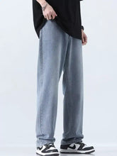 Men’s relaxed fit straight leg jeans in light-wash denim with a subtle texture and comfortable straight-leg cut
