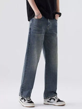 Men’s relaxed fit vintage wash jeans in dark-wash denim with a straight-leg cut and subtle thigh fading