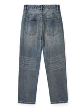 Men’s relaxed fit vintage wash jeans shown from the back in faded blue denim with classic back pockets
