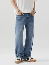 Men’s relaxed fit wash jeans in light-wash blue denim with a relaxed straight-leg cut for comfortable wear