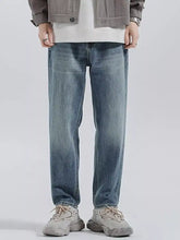 Men’s relaxed fit wash jeans in light-wash blue denim with a relaxed straight-leg cut