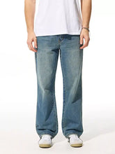 Men’s relaxed fit jeans in blue denim with a relaxed fit wash and straight-leg cut for casual wear
