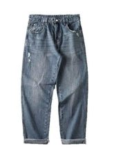 Men’s relaxed fit wash jeans in light-wash denim with subtle distressing and rolled cuffs for casual wear
