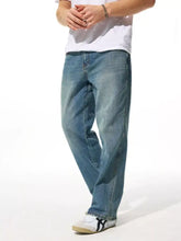 Men’s relaxed fit wash jeans in light-wash blue denim with a relaxed fit and straight-leg cut