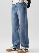 Men’s relaxed fit wash jeans in light-wash blue denim featuring a relaxed straight-leg cut for comfortable wear