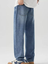 Men’s relaxed fit wash jeans in light-wash denim with a relaxed fit straight-leg cut and classic back pockets