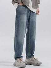 Men’s relaxed fit wash jeans in light-wash denim with a straight-leg cut and classic stitching details