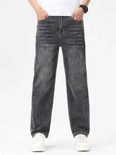 Men’s relaxed fit washed jeans in dark gray faded denim with a straight-leg cut and classic stitching