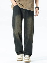 Men’s relaxed fit washed dark-wash denim jeans with a relaxed straight-leg cut and subtle vintage fading