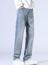 Men’s relaxed fit wide leg light-wash denim jeans with a relaxed fit straight-leg cut and visible stitching details