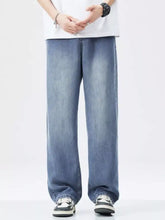 Men’s relaxed fit wide leg jeans in light-wash blue denim with a vintage straight-leg cut