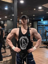 Muscular man in mens round neck graphic tank with praying hands design