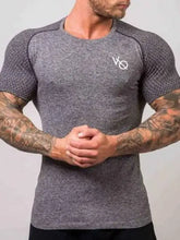 Mens round neck short sleeve gray athletic t-shirt with textured shoulders