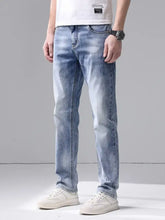 Men’s slim fit jeans in light-wash denim with subtle fading and a slim fit design along the thighs