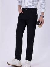 Men’s slim fit jeans in black denim with a classic five-pocket design and subtle stitching details