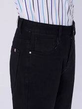 Men’s slim fit black denim jeans with a straight-leg cut and subtle stitching details for slim fit jeans style