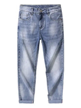 Men’s slim fit jeans in light-wash denim with a slim fit and rolled cuffs for a modern look