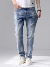 Men’s slim fit jeans in light-wash denim with subtle fading and a slim fit cut along the thighs