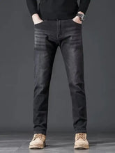 Men’s slim fit wash jeans in black denim with subtle fading details and a contemporary slim fit design