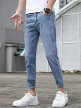 Men’s slim-fit light-wash denim jeans with rolled cuffs for a modern slim fit wash style