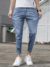 Men’s slim-fit wash jeans in light-wash denim with a slim fit cut and rolled cuffs for a stylish look