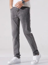 Men’s slim fit washed dark gray denim jeans with faded wash and classic stitching for a modern fit look