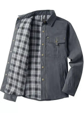 Men’s dark gray long sleeve jacket with snap button closures and black and white plaid lining, featuring two front pockets