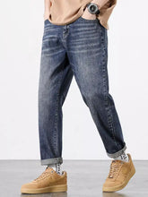 Men’s straight fit dark-wash denim jeans with relaxed fit and rolled cuffs for casual wear