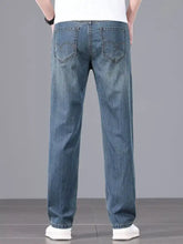 Men’s blue denim straight fit jeans with a classic cut and subtle fading made from durable material
