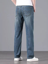 Men’s blue denim straight fit wash jeans with classic straight-leg cut and subtle fading
