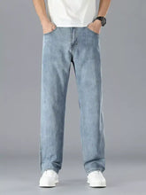 Men’s straight leg jeans in light-wash denim with a relaxed, straight-leg cut and subtle fading for a modern casual look