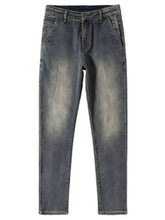 Men’s straight leg vintage wash jeans in dark wash denim with faded distressed areas on thighs and knees