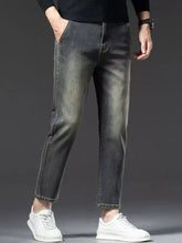 Men’s straight leg vintage wash jeans in dark-wash denim with slim fit and rolled cuffs perfect for casual wear