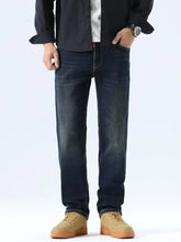 Men’s straight leg washed dark-wash denim jeans with subtle fading on the thighs and a straight leg cut