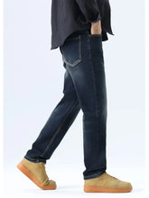 Men’s straight leg washed dark-wash denim jeans with classic stitching and a straight leg cut