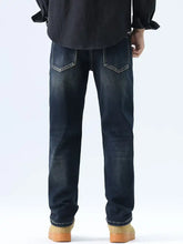 Men’s dark-wash straight leg washed denim jeans with subtle fading and white stitching along the pockets