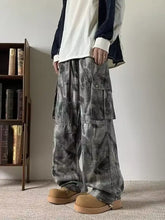 Men’s gray tie-dye loose fit cargo jeans with multiple pockets and a drawstring waist for casual wear