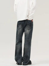 Men’s vintage distressed wide leg jeans in dark-wash denim with relaxed fit and faded distressing details