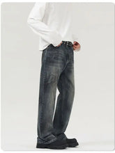 Dark-wash denim men’s vintage distressed wide leg jeans with relaxed straight-leg cut and subtle distressed details