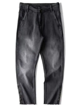 Men’s vintage black denim raw hem jeans with zipper details at the cuffs showcasing raw hem jeans design