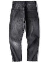 Dark gray distressed men’s vintage raw hem jeans featuring a faded wash and frayed raw hem jeans design