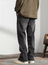 Men’s vintage dark gray denim raw hem jeans with relaxed fit and frayed hems for casual wear