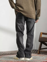 Dark gray men’s vintage denim jeans with straight-leg cut and distinctive raw hem for a classic look