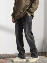 Men’s vintage dark gray denim raw hem jeans with straight-leg cut and frayed raw hem detail