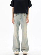 Men’s vintage wash flare jeans in light-wash denim with a relaxed wide-leg cut for a casual vintage wash look