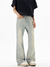 Men’s vintage wash flare jeans in light-wash denim with a relaxed wide-leg cut and subtle fading