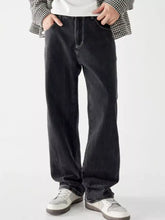 Men’s vintage wash loose fit black denim jeans with relaxed straight-leg cut and visible stitching details