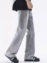 Men’s vintage wash loose fit light gray denim jeans with straight leg and subtle whiskering details