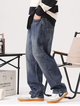 Blue denim men’s vintage wash loose fit jeans with relaxed fit and classic stitching details