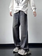 Men’s dark gray denim jeans with a vintage wash loose fit featuring straight legs and subtle fading for casual wear